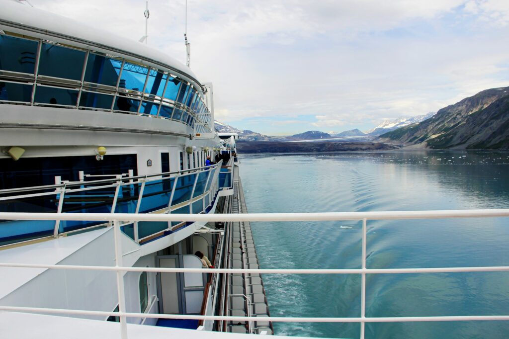 Side view from an Alaskan cruise deck with beautiful glacier & mountains in background